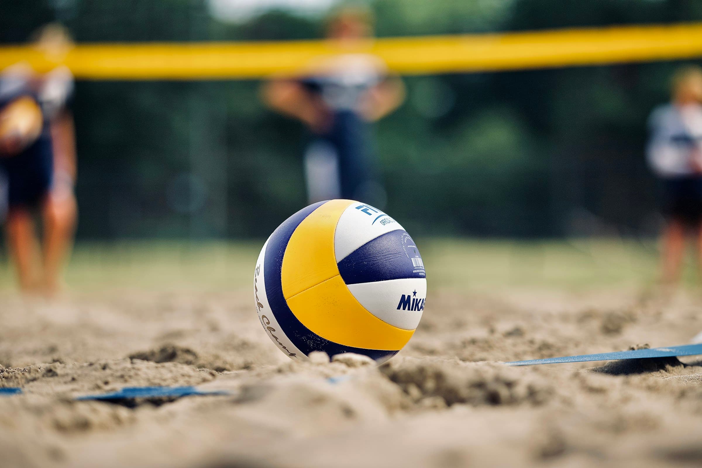 Volleyball court with athletes warming up