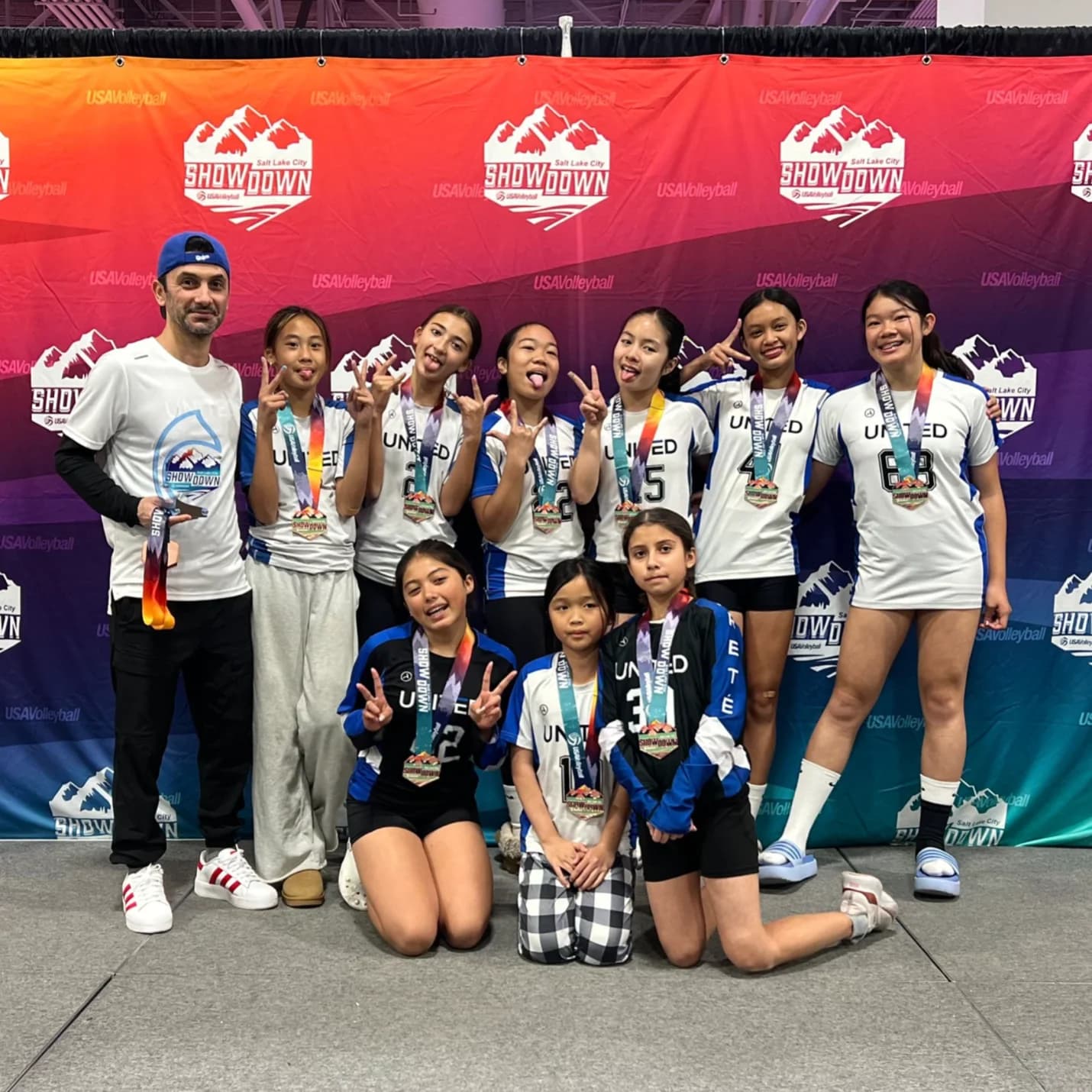 United OC team celebrating at the USA Volleyball Showdown tournament