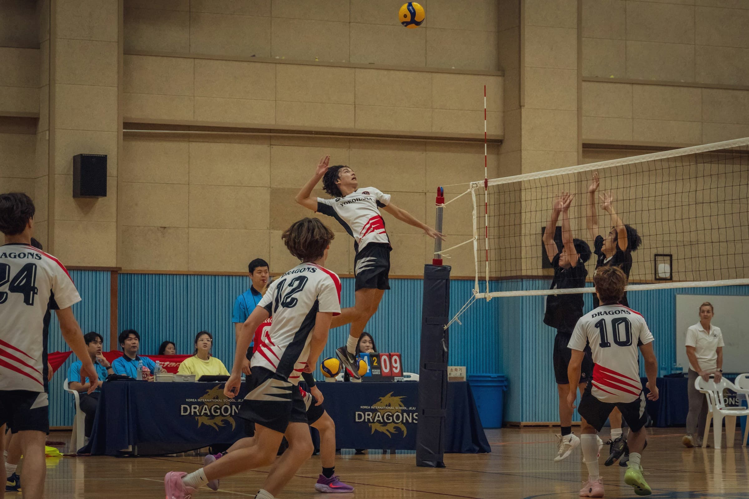 Experienced coach directing a volleyball practice session